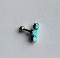 Piercing in Gehrden 3 k&uuml;nstliche Opale hellblau